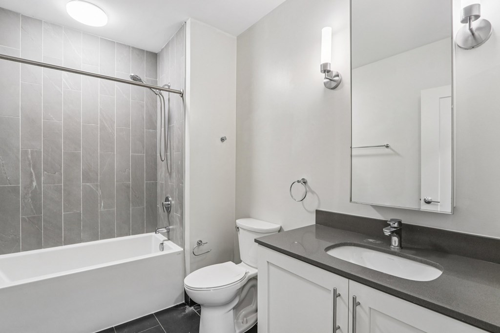 Bathroom with sink and bathtub at Park77 Apartments, Cambridge