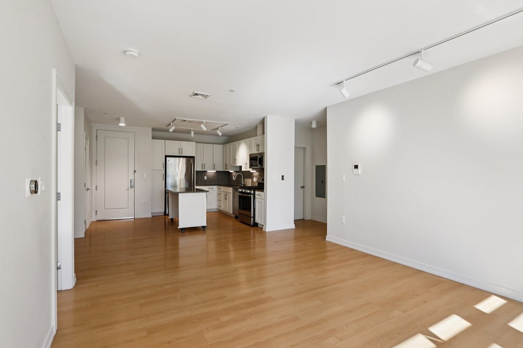 Unfurnished living room with wooden floor at Park77 Apartments, Cambridge, MA, 02138