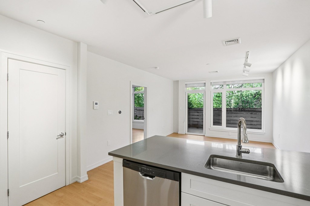 Kitchen with sink and dishwasher at Park77 Apartments, Cambridge, Massachusetts