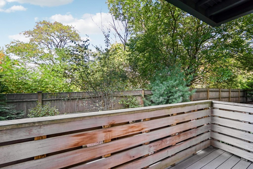 Wooden deck with a view of a backyard at Park77 Apartments, Cambridge
