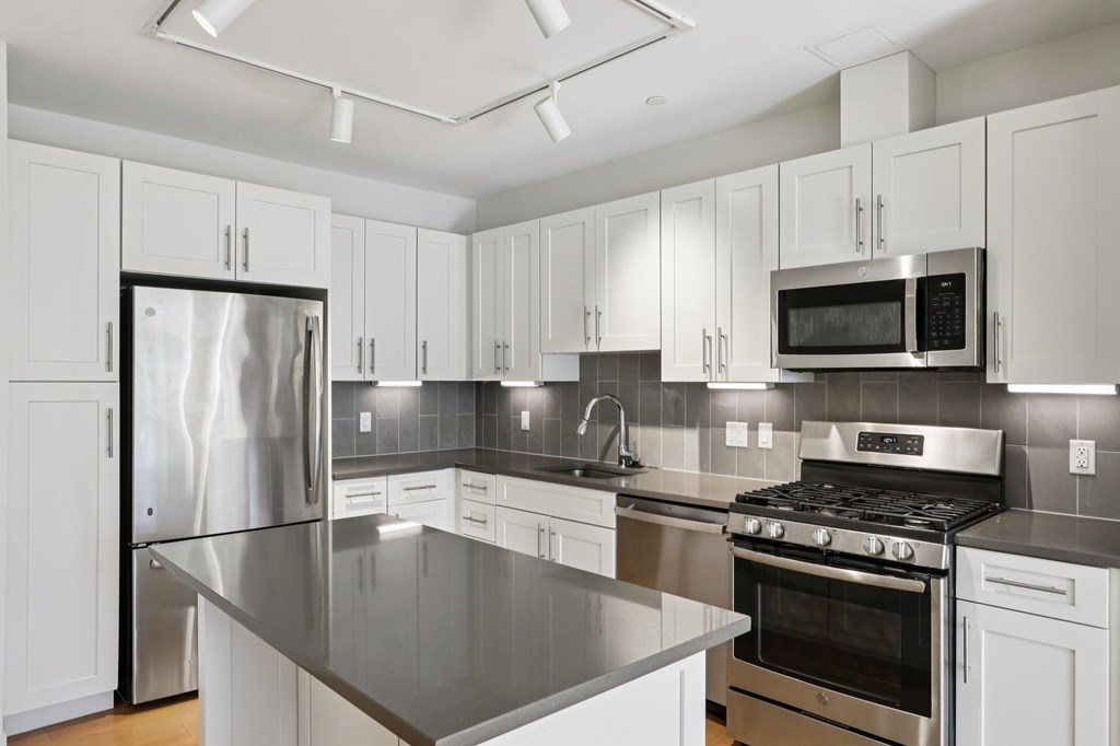 Kitchen with white cabinets at Park77 Apartments, Cambridge, MA