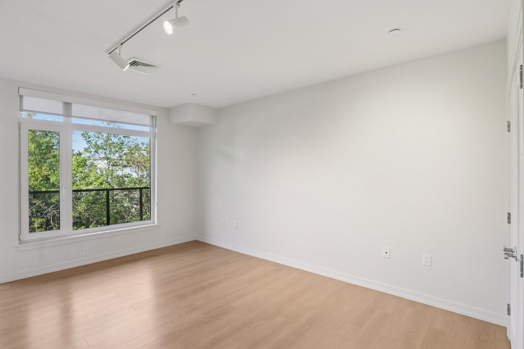 Unfurnished bedroom with sliding door window at Park77 Apartments, Massachusetts, 02138