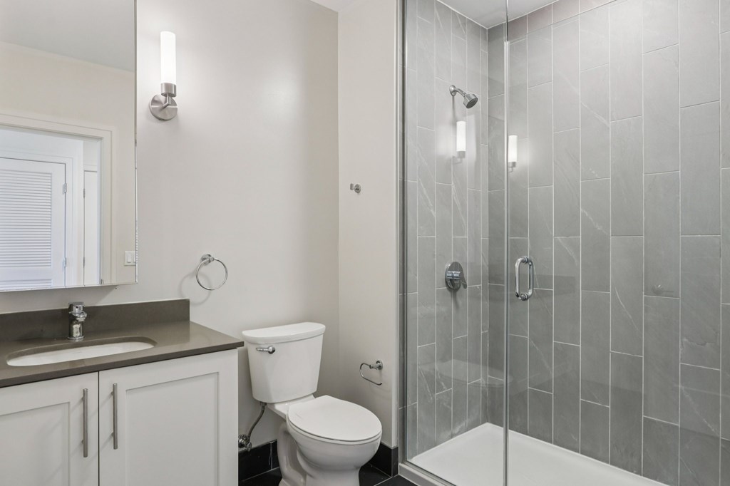 Bathroom with a shower and toilet at Park77 Apartments, Massachusetts