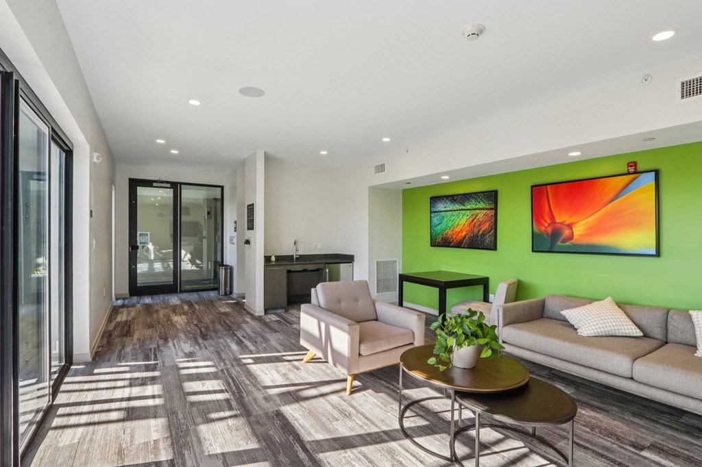 Living room with paintings at Park77 Apartments, Massachusetts