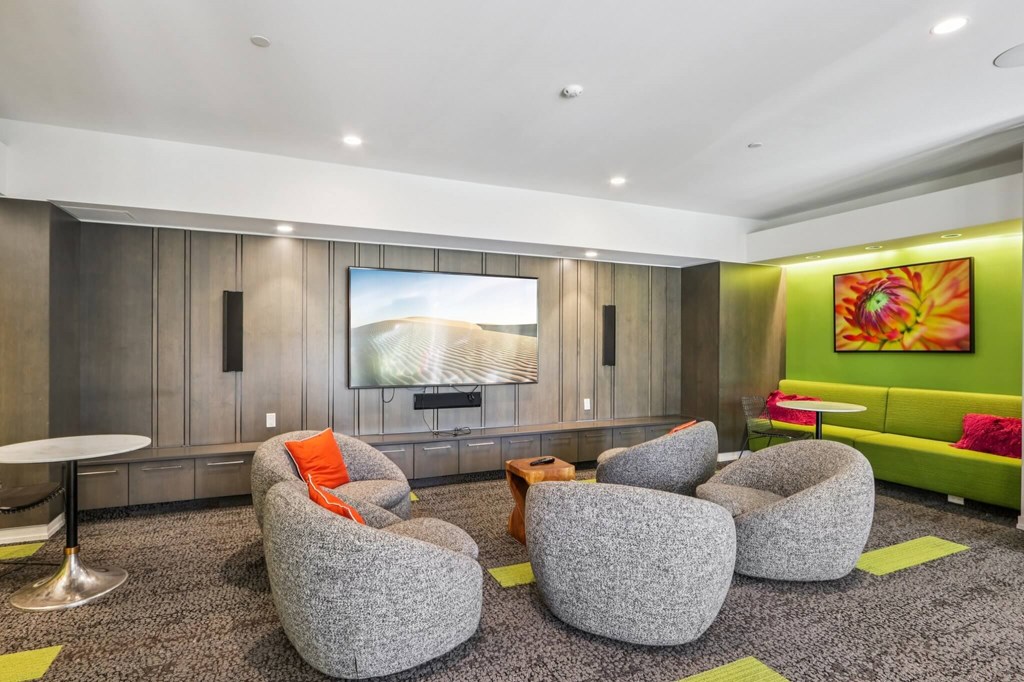 Common living room with grey chairs at Park77 Apartments, Massachusetts, 02138