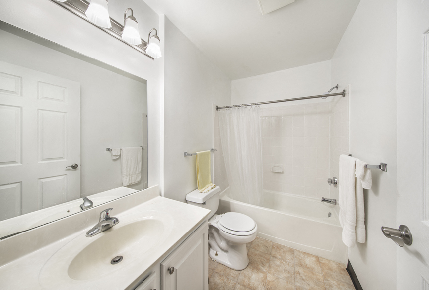 a bathroom with a sink and a toilet and a shower