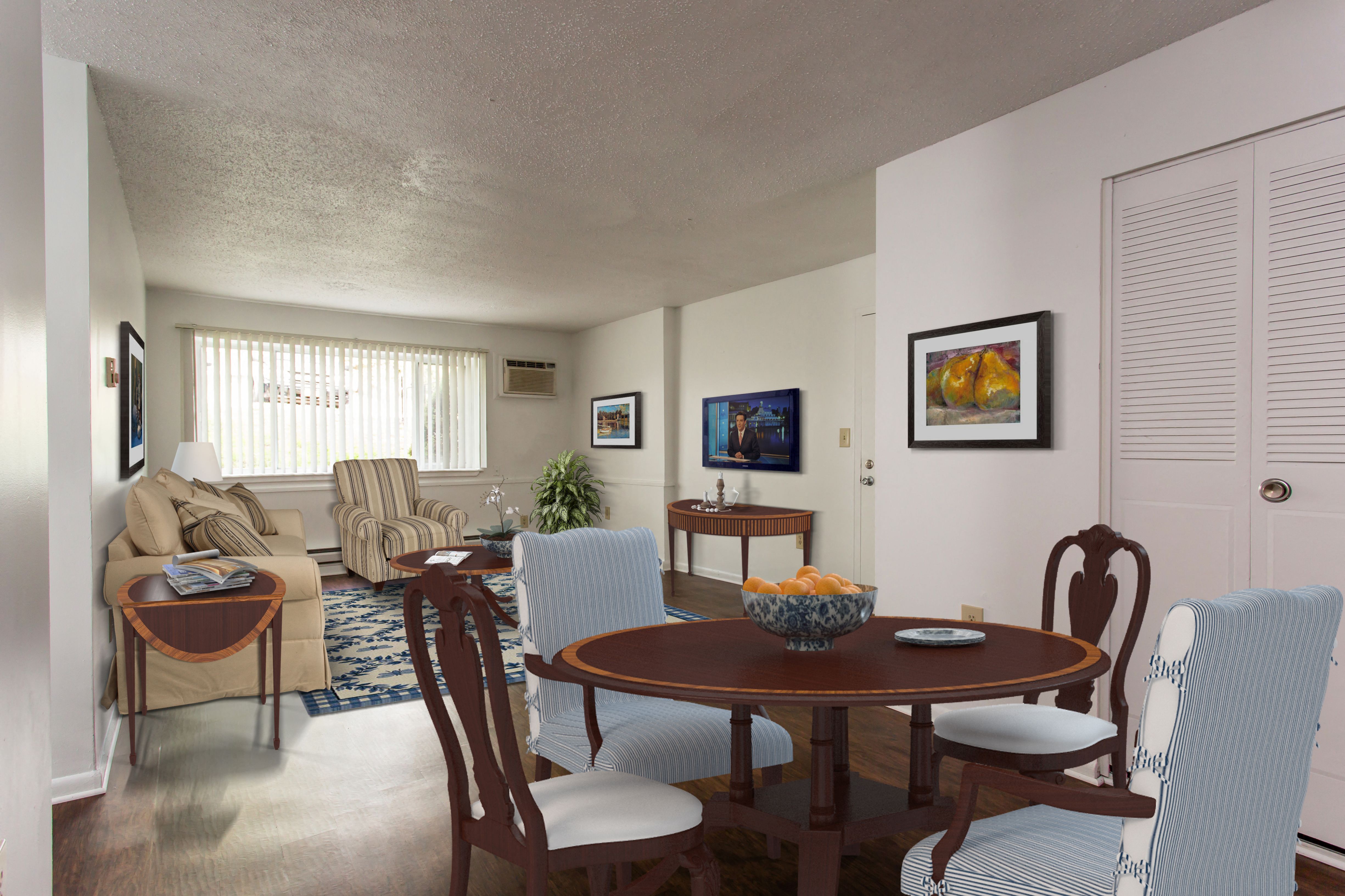 Living Room With Television at Highland Club Apartments at Watervliet, NY 12189