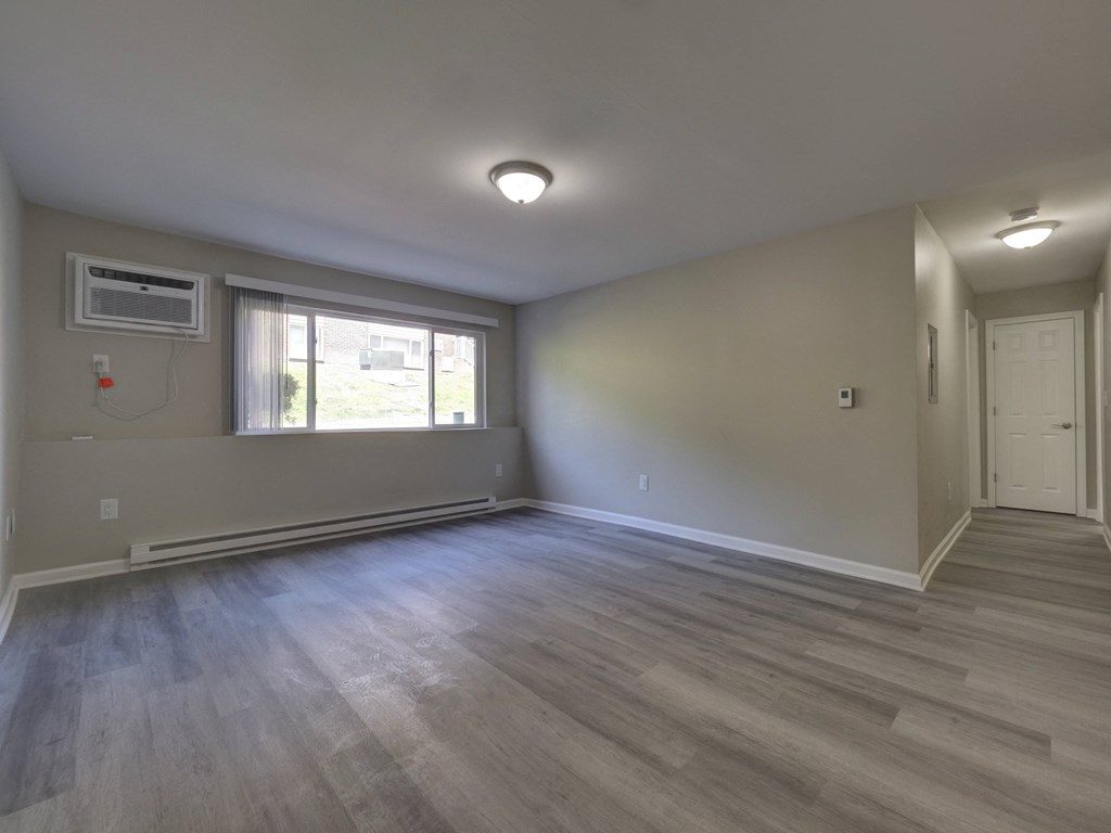 Empty Living Room at Highland Club Apartments, Watervliet, NY 12189