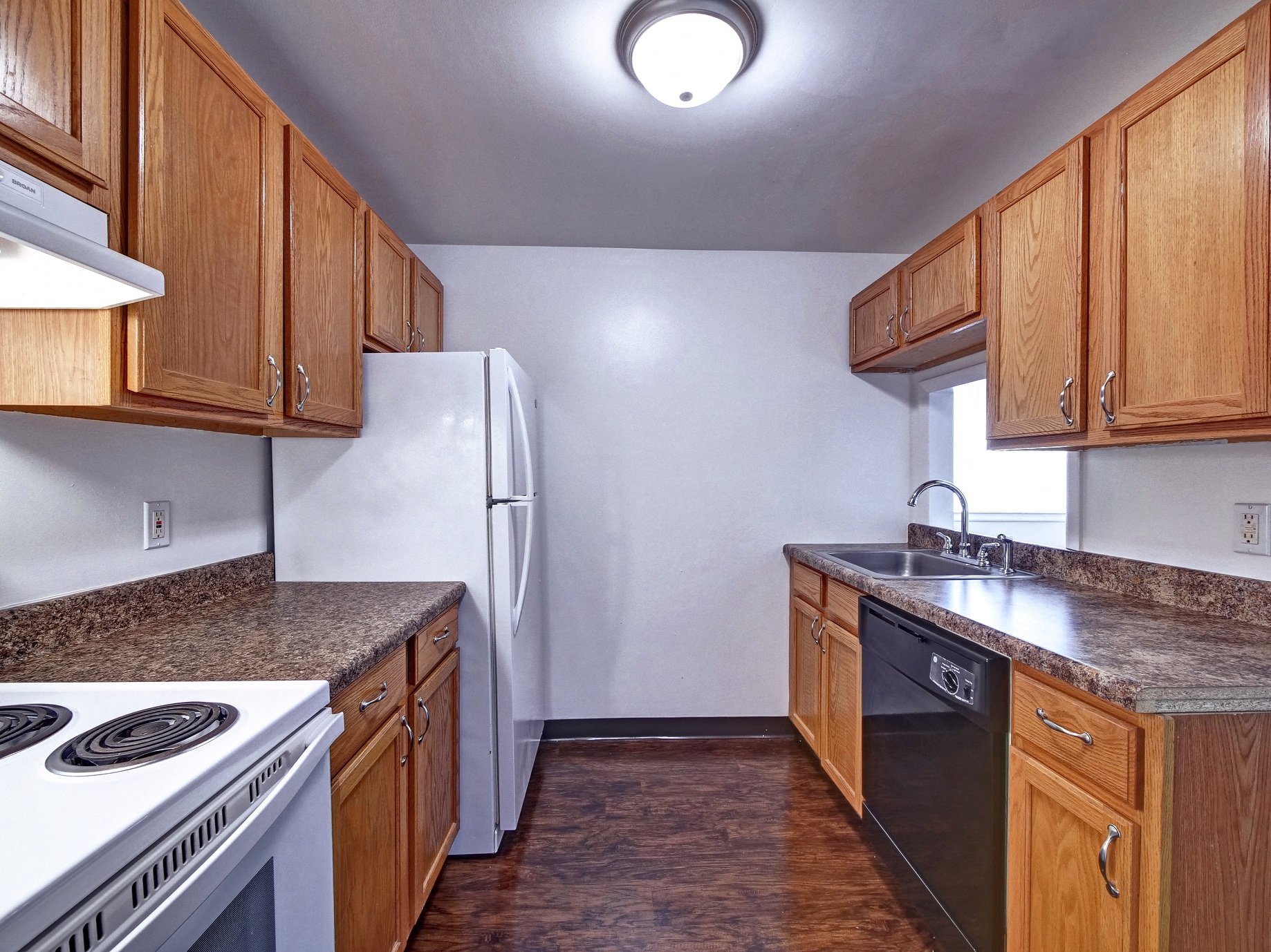 Updated Kitchen with Marbled Brown Countertops at Highland Cub Apartments, Watervliet, NY 12189