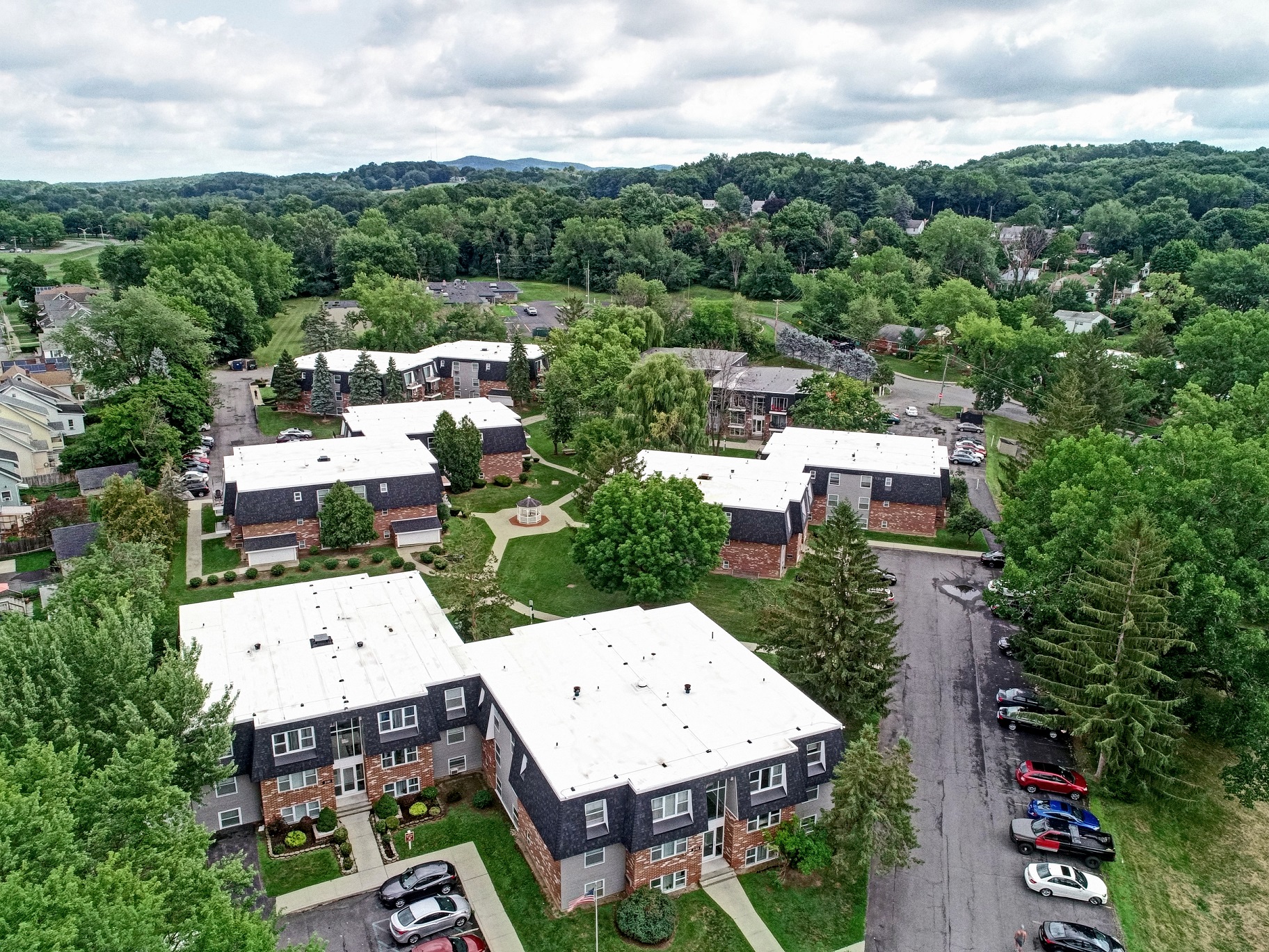 an aerial view of a neighborhood with houses and trees