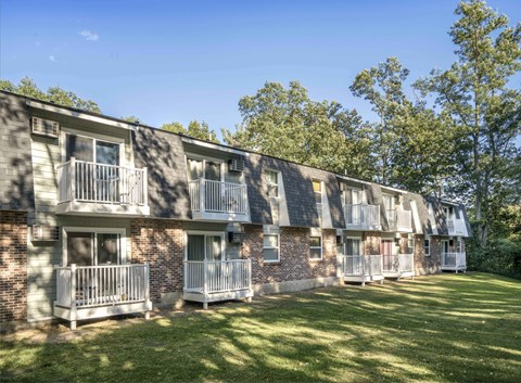 our apartments are located in a quiet area with green grass and trees
