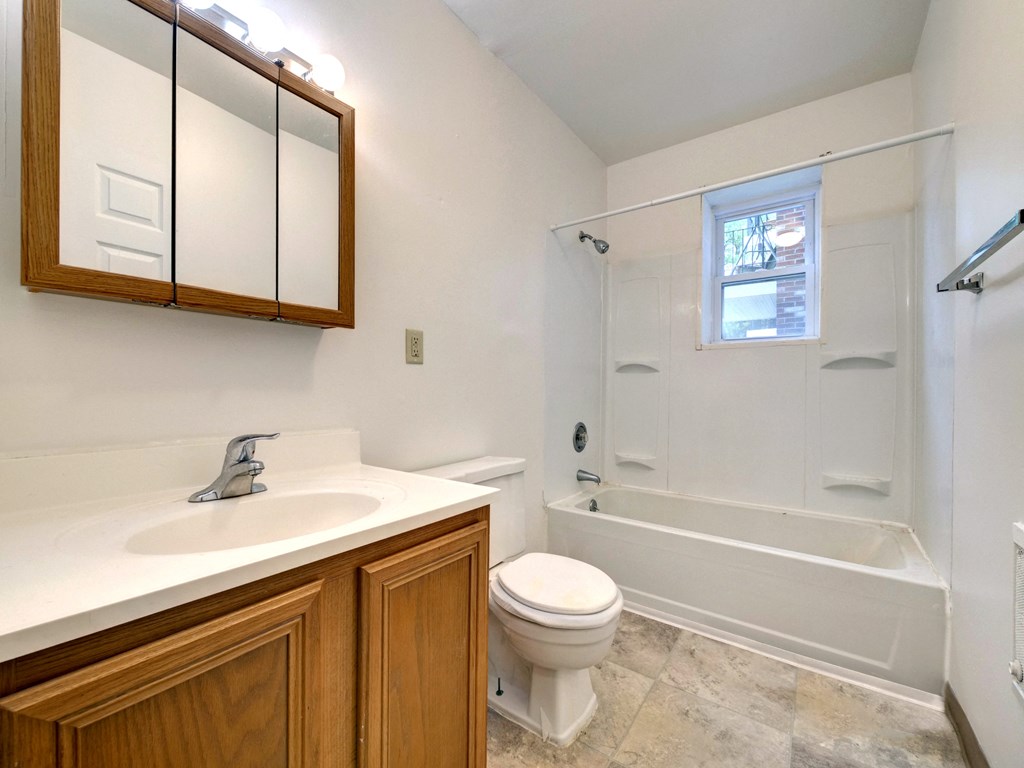 a bathroom with a sink toilet and a shower