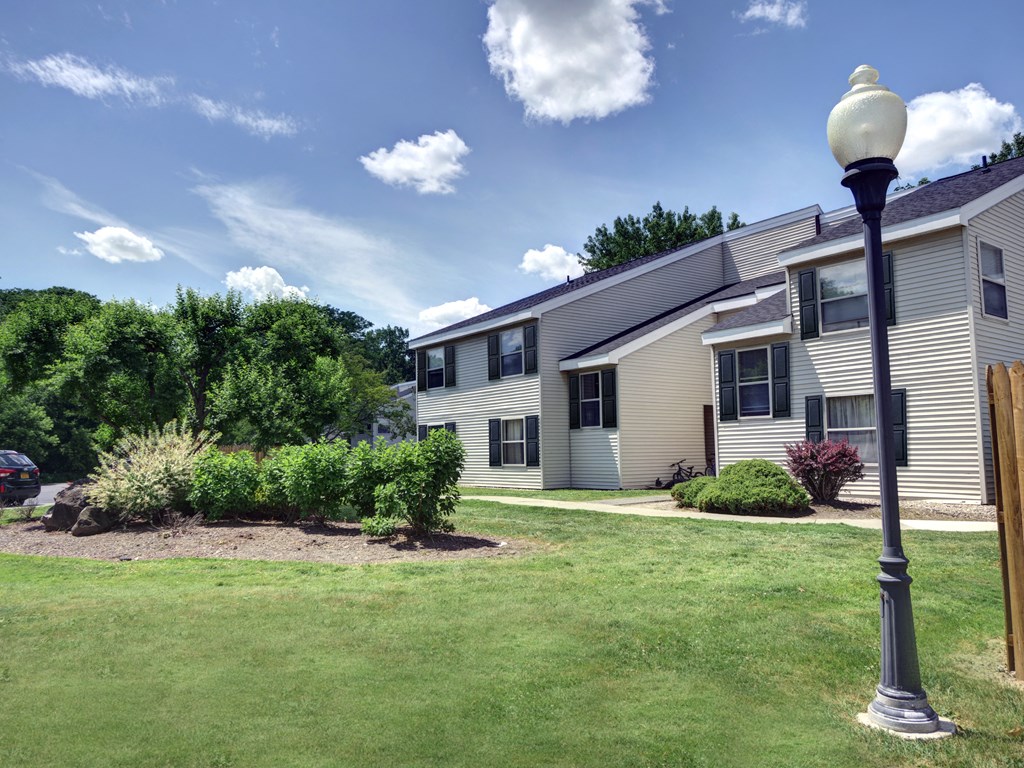 a home with a lamp post in the yard