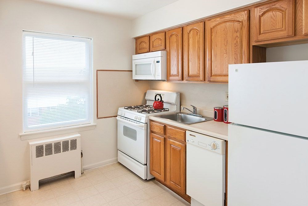 a kitchen with a stove microwave and refrigerator