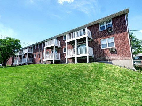 our apartments are located on the top of a green hill