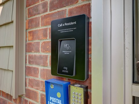 A sign on a wall that says "Call a Resident" is displayed.