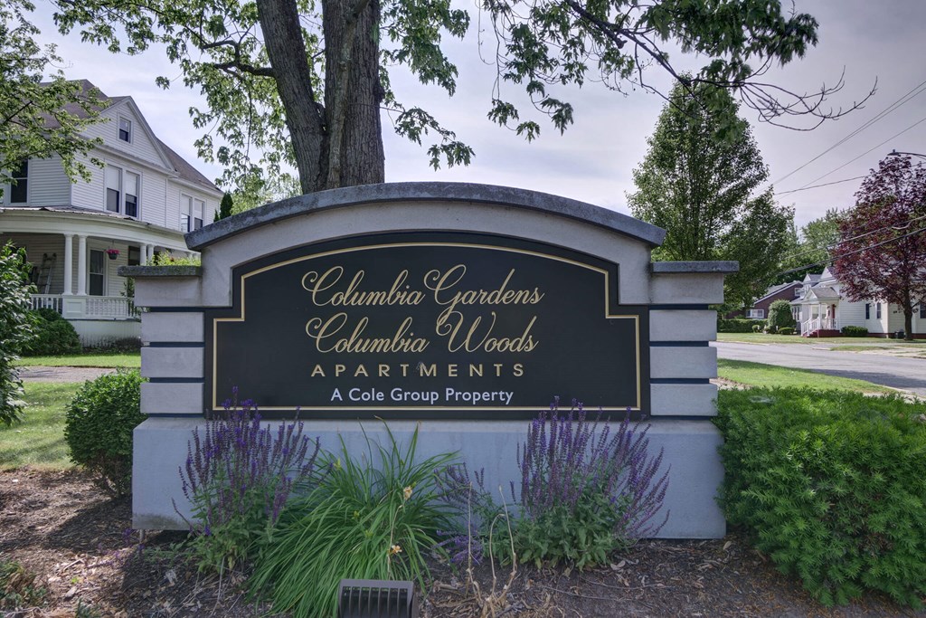 a sign for columbia gardens apartments