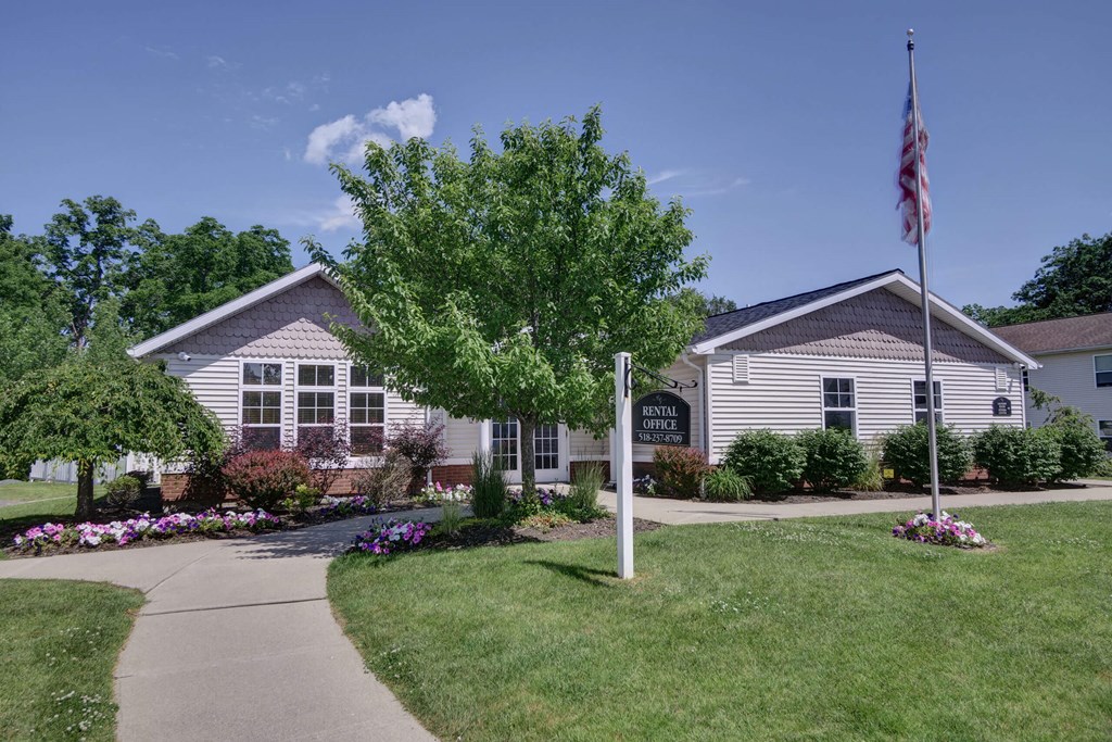 a house with an american flag in front of it