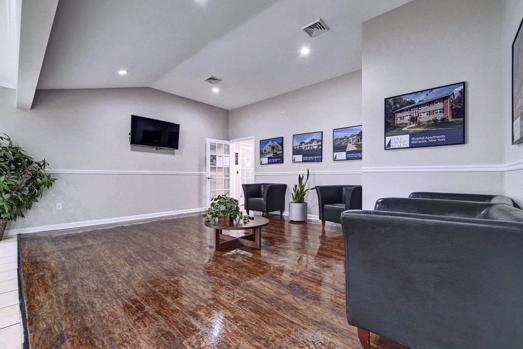 a living room with couches and a coffee table