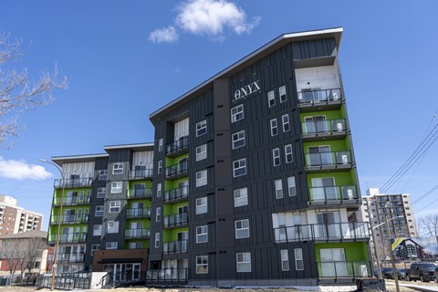 A modern building with the name ONYX on the top.