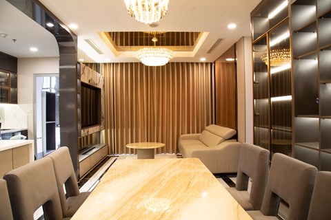 A conference room with a long table and chairs.