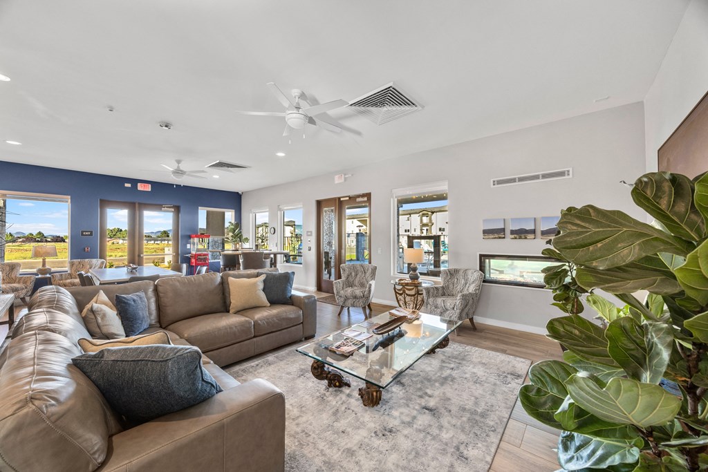 a living room with couches and chairs and a coffee table