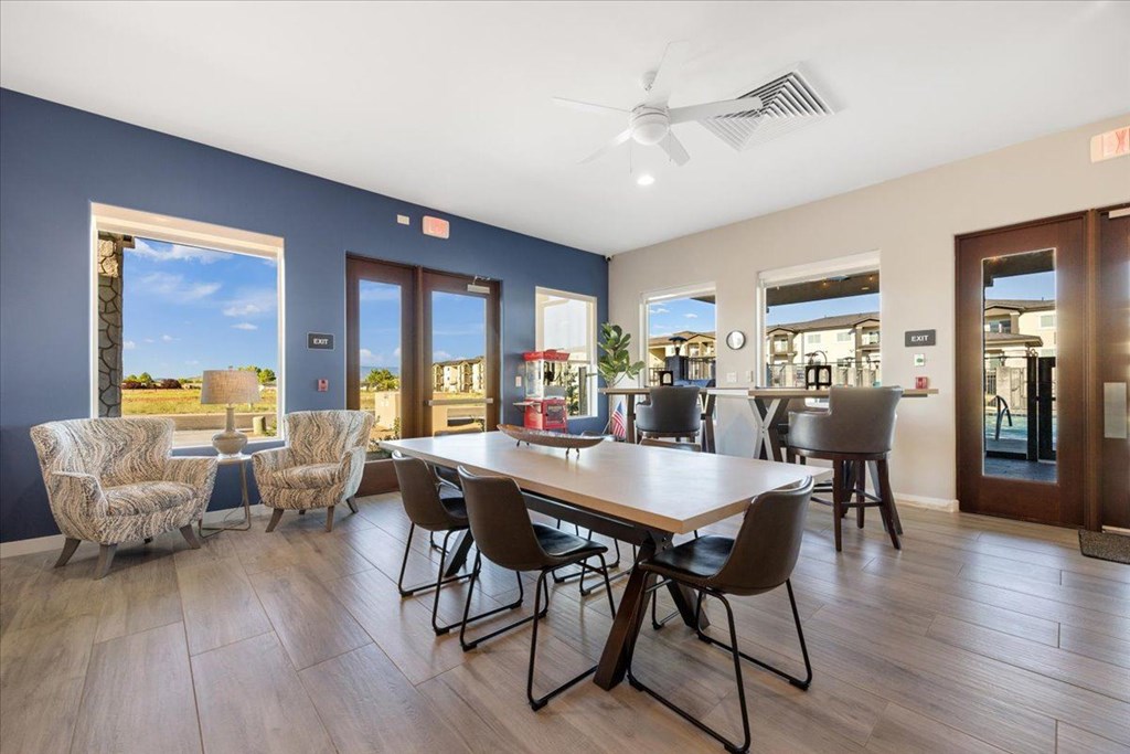 a dining room with a table and chairs
