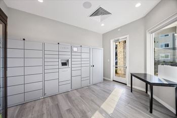 a white room with a large white closet and a table