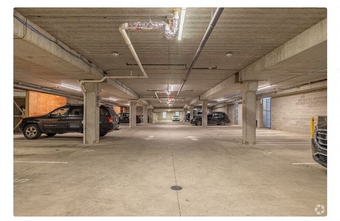 a parking garage with cars parked in it