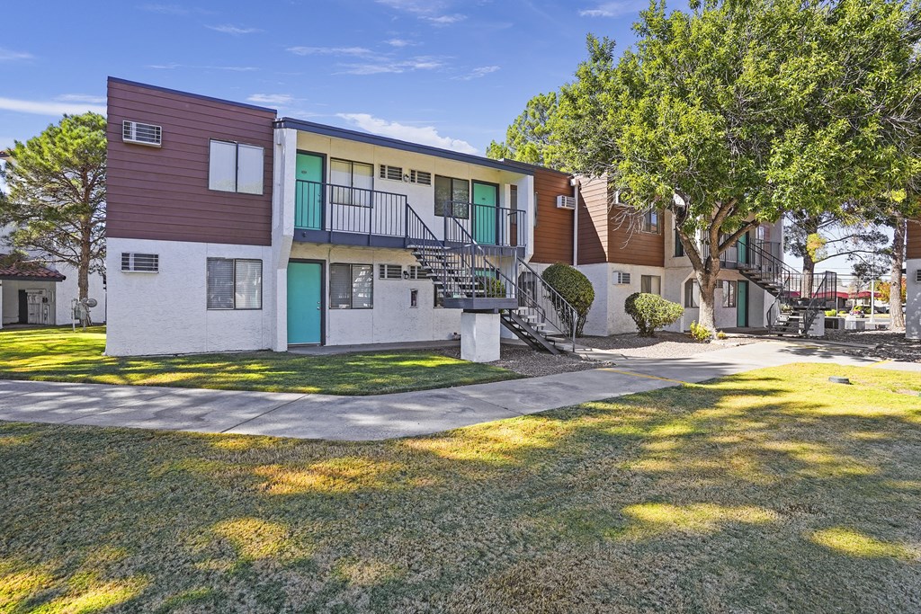 our apartments have a spacious courtyard with grass and trees