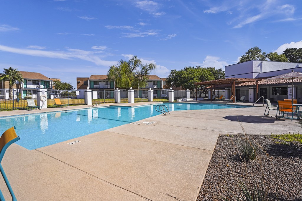 our apartments have a resort style pool with chairs and a gazebo