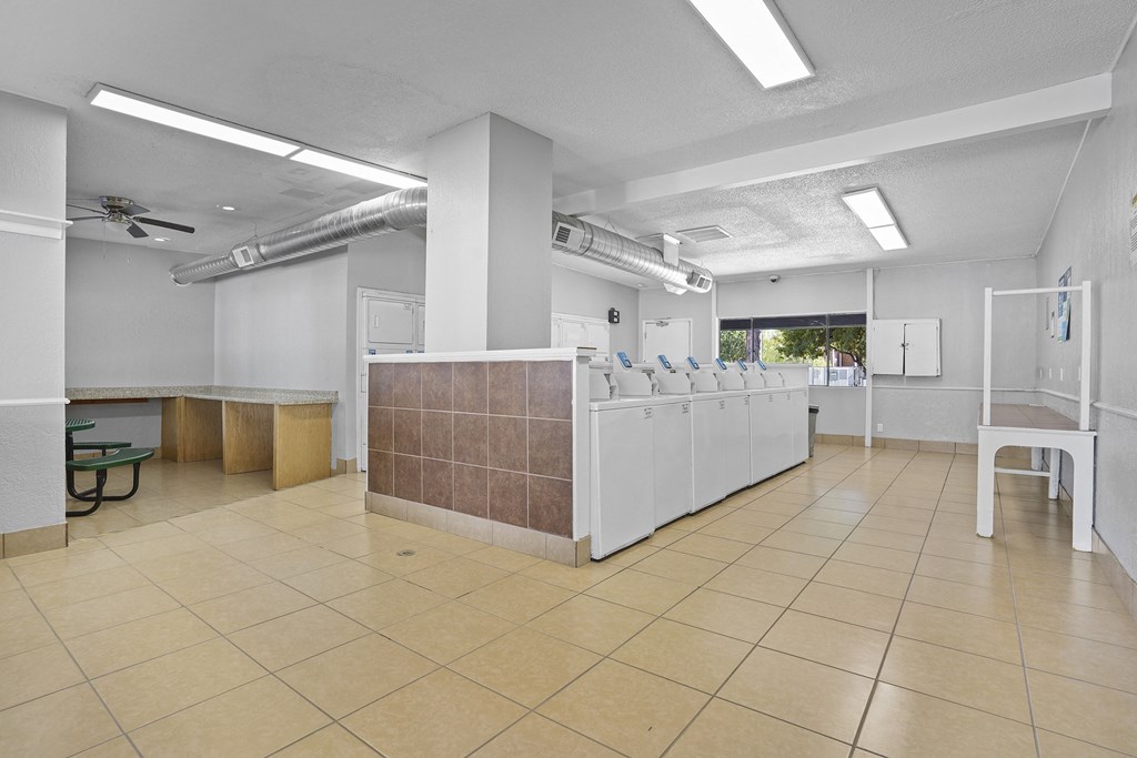 a room with a reception desk and chairs in it