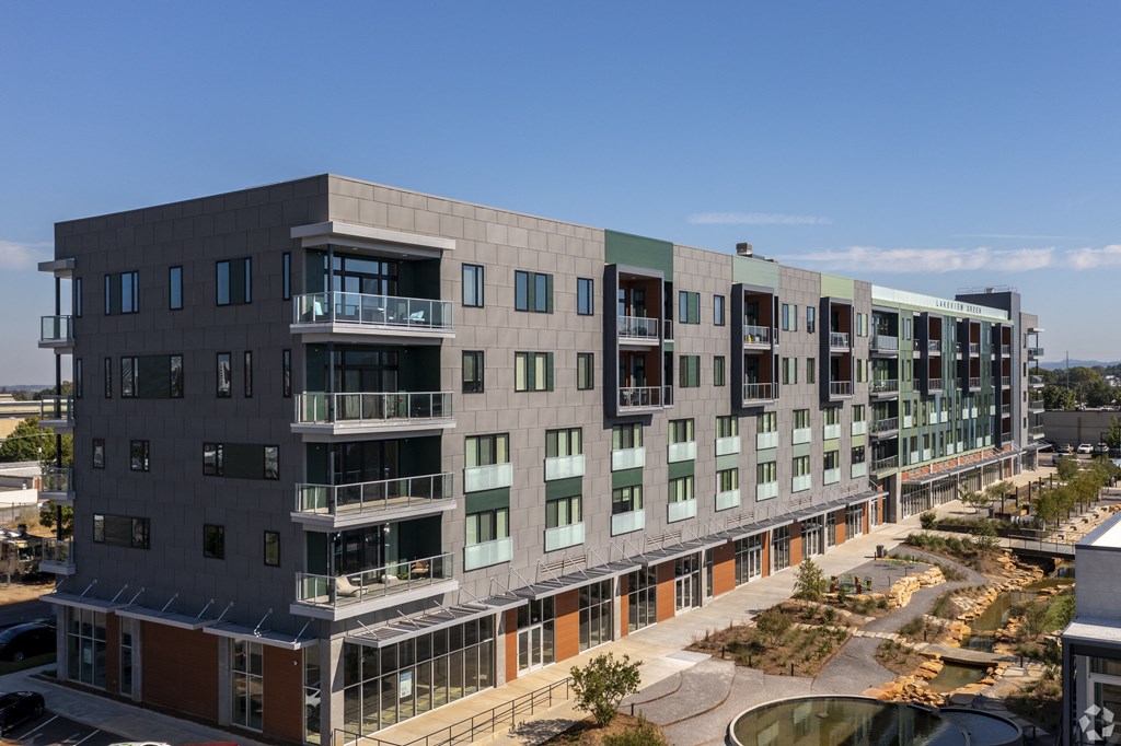 an aerial view of an apartment building with a courtyard