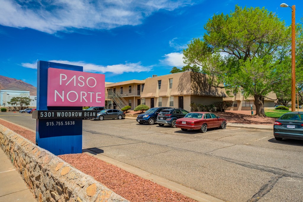 a parking lot with a sign that reads