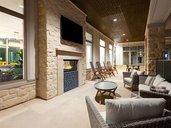 Living room with TV Outdoor Living room with TV at The Kelley Apartments, Ft. Worth, Texas - Photo Gallery 4
