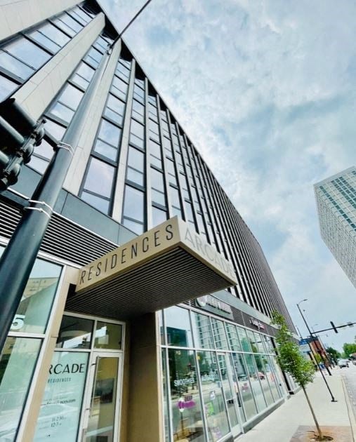 a tall building with a sign on the front of it