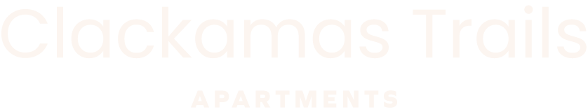 Clackamas Trails Apartments sign with white text on green background.