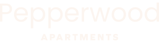 A sign that says Pepperwood Apartments.
