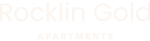 The image is of a logo for Rocklin Gold Apartments.