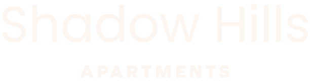 The image is a logo for Shadow Hills Apartments.