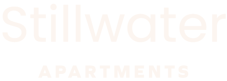 A sign that says Stillwater Apartments.