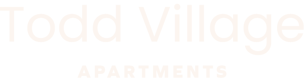A sign that says Todd Village Apartments.