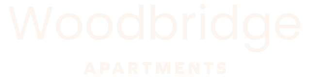 A sign that says Woodbridge Apartments.