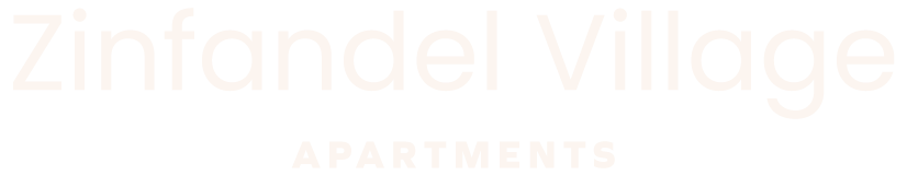 A sign that says Zinfandel Village Apartments.