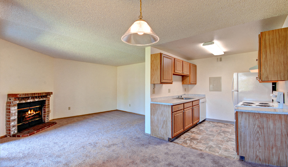 Living Room With Fireplace at Chambers Creek Estates, University Place, 98467