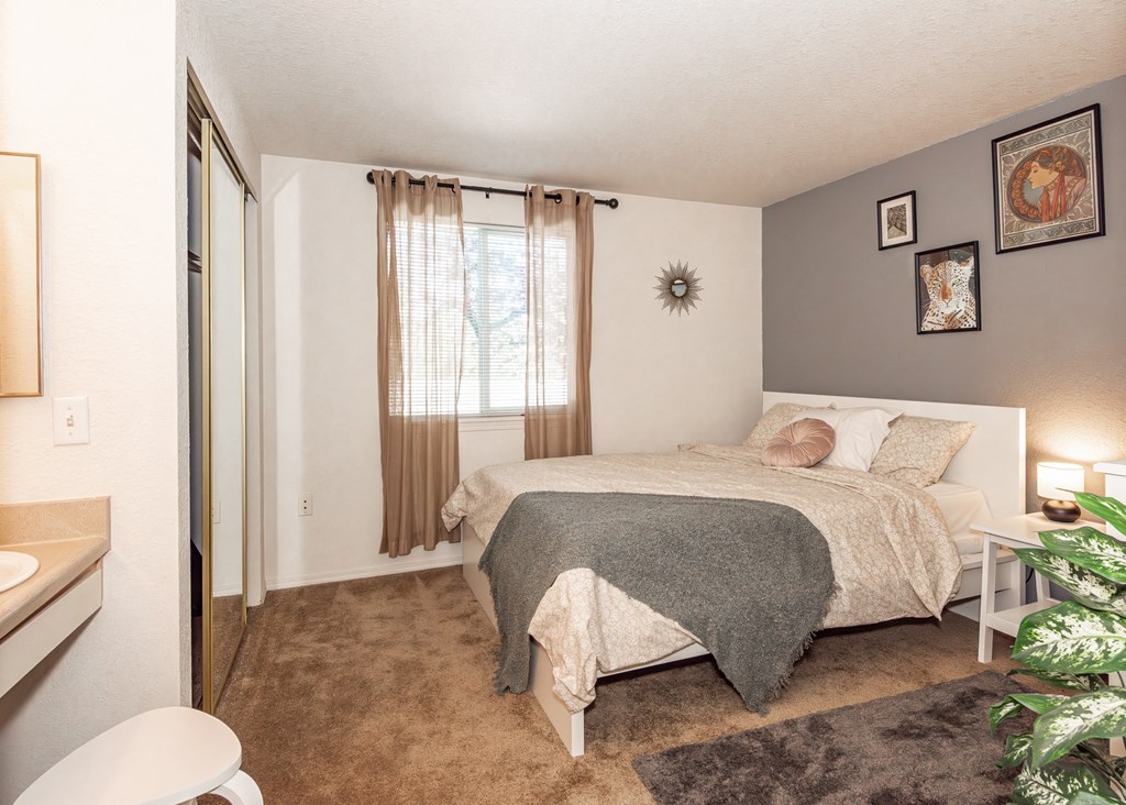model primary bedroom at Clackamas Trails Apartments, OR 97222
