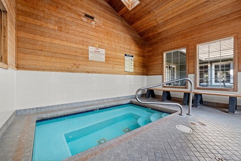 An indoor spa with a bench and a window at Clackamas Trails Apartments, Oregon, 97222