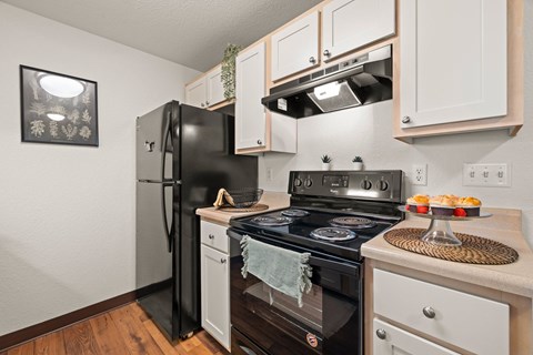 A black stove top oven with a towel on it.