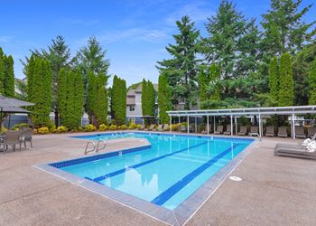 Creekside Village outdoor swimming pool and arbor with lounges