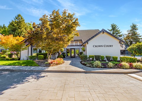 The front of the Crown Court building is shown with a clear blue sky in the background.